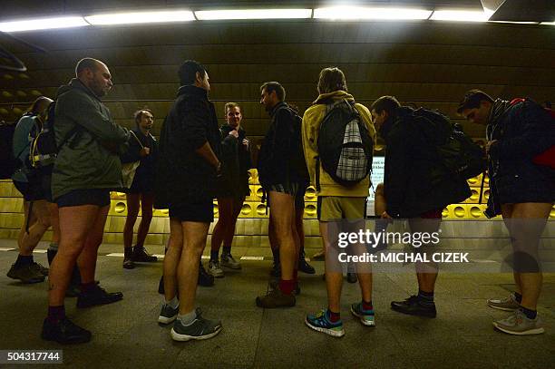 Passengers without pants wait for a subway train during the "No Pants Subway Ride" on January 10, 2016 in Prague. The No Pants Subway Ride is an...