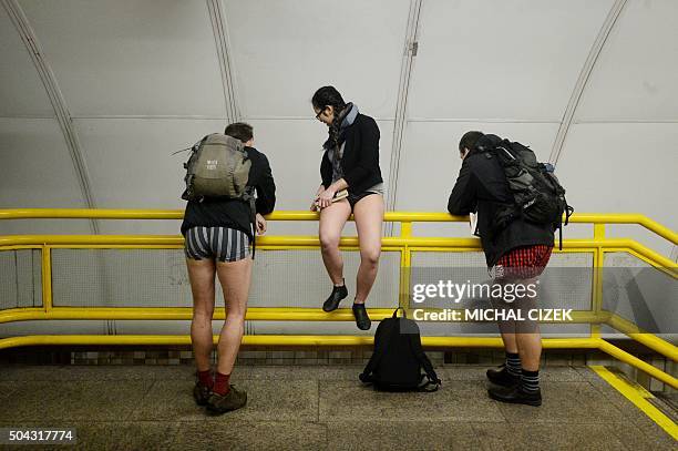 Passengers without pants wait for the subway during the "No Pants Subway Ride" on January 10, 2016 in Prague. The No Pants Subway Ride is an annual...