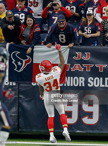 Knile Davis of the Kansas City Chiefs runs back the opening kick-off 106 yards for a touchdown against the Houston Texans during the AFC Wild Card...