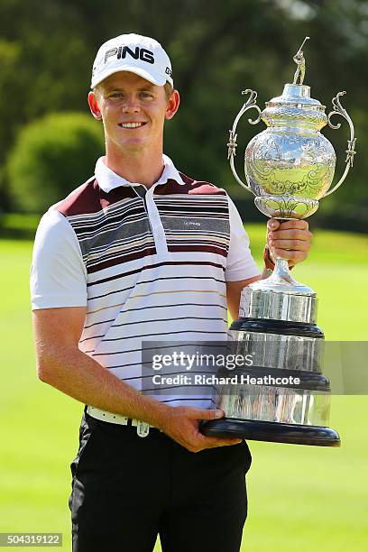 Champion Brandon Stone of South Africa poses with the South African Open trophy following his victory in the BMW SA Open at Glendower Golf Club on...