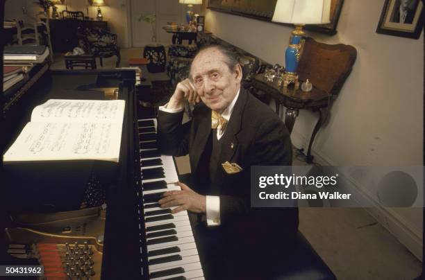 Pianist Vladimir Horowitz poised at piano, at his home in NYC.