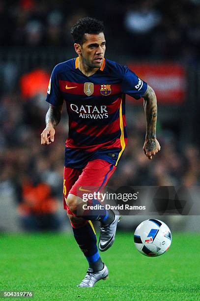 Dani Alves of FC Barcelona runs with the ball during the Copa del Rey Round of 16 first leg match between FC Barcelona and RCD Espanyol at Camp Nou...