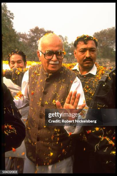 Hindu nationalist BJP member of Parliament/ex-Bharatiya Janata Party pres. L.K. Advani greeting supporters, on Agra Road S. To Mathura.
