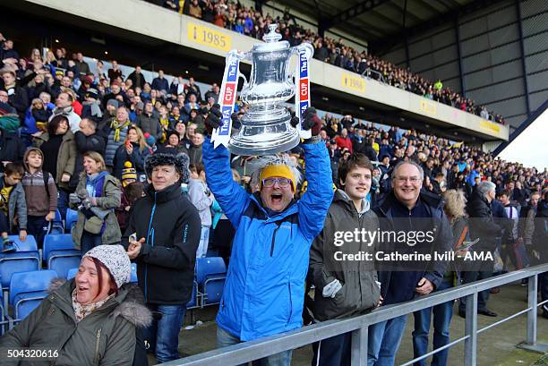 Celebrity and Oxford United fan Timmy Mallett celebrates the win with a cardboard FA Cup trophy after The Emirates FA Cup match between Oxford United...