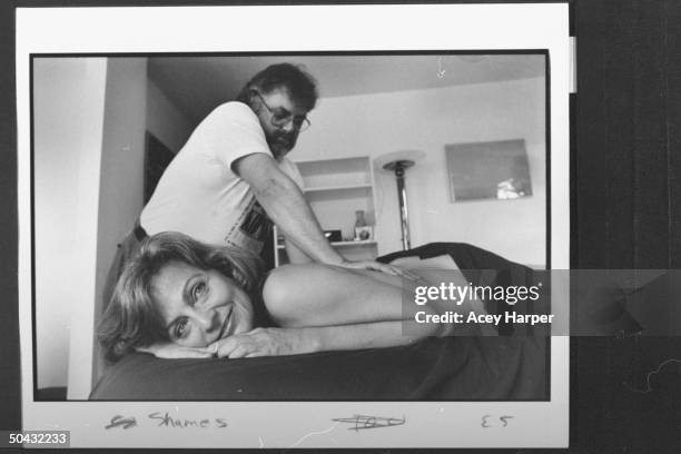 Documentary filmmaker Deborah Shames getting a massage from therapist F. Joseph Smith.