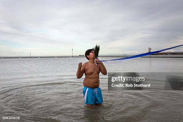 Adam Marinou from Canterbury retrieves a crucifix from the sea during a traditional Greek Orthodox blessing at Margate beach for the Feast of the...