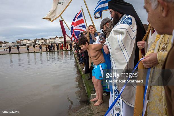 Adam Marinou from Canterbury prepares to retrieve a crucifix from the sea at Margate beach during a traditional Greek Orthodox blessing for the Feast...