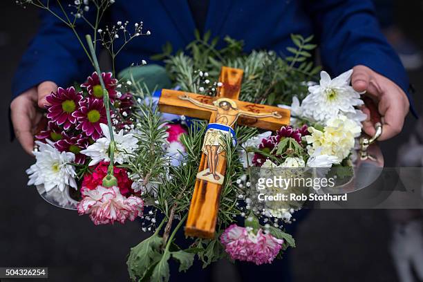 Adam Marinou from Canterbury carries a crucifix in a procession to Margate beach during traditional Greek Orthodox celebrations for the Feast of the...