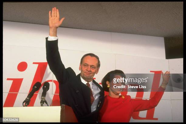 Canadian Prime Minister-elect Jean Chretien waving & smiling w. Wife Aline during victory celebration.