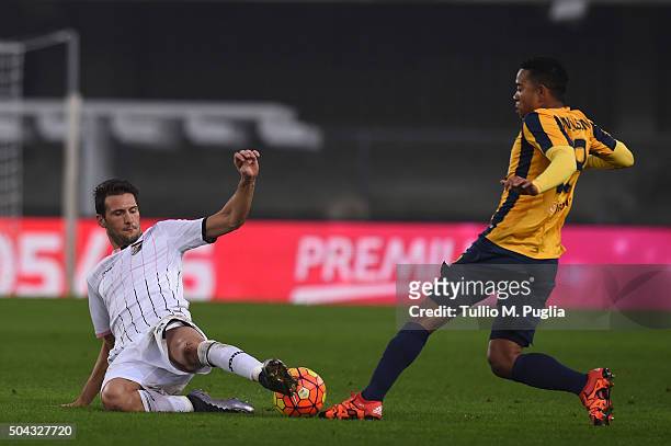 Franco Vazquez of Palermo and Urby Emanuelson of Hellas verona compete for the ball during the Serie A match between Hellas Verona FC and US Citta di...