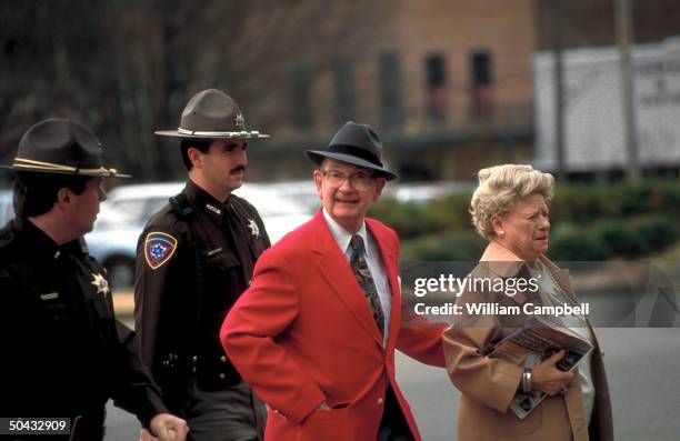 State troopers escorting Byron de la Beckwith & wife to court during white supremacist's 3rd trial for 1963 murder of civil rights activist Medgar...