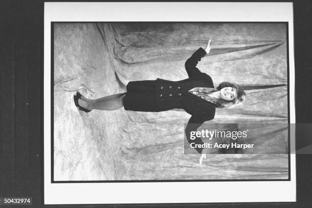 Anchor Cheryl Atkisson posing in front of photographer's velvet backdrop at Cable News Network HQ.