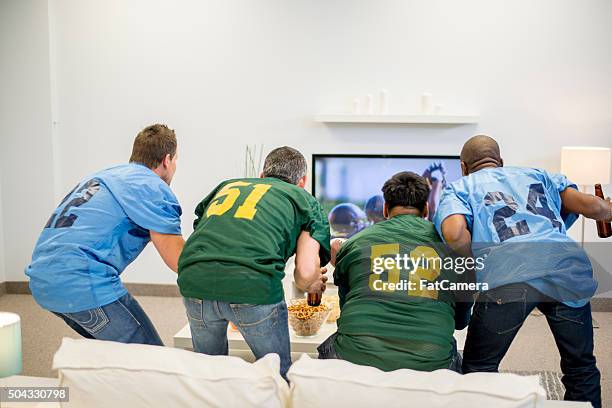 suspense during the game - american football tv stock pictures, royalty-free photos & images