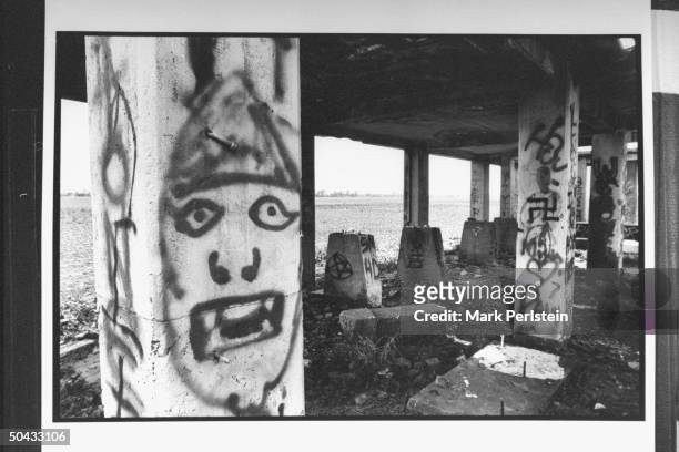 Graffiti written on pillars at abandoned cotton gin where accused murderers, Michael Damien Wayne Echols, Jessie Lloyd Misskelley Jr. & Charles Jason...