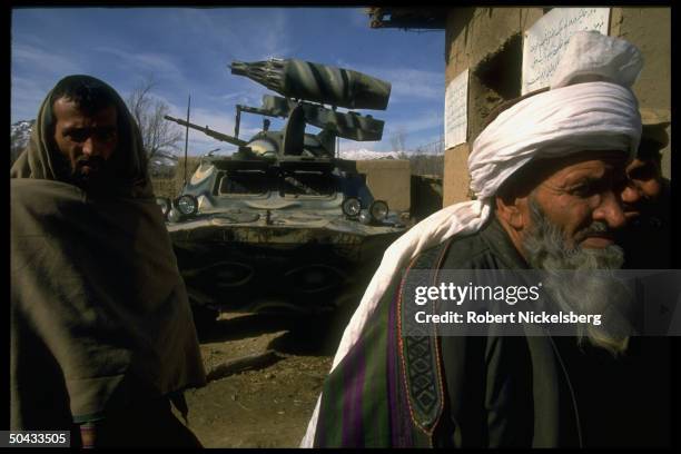 Fighters loyal to renegade PM Hekmatyar & ally Dostam at PM's base, w. Armored vehicle; Charasiab.