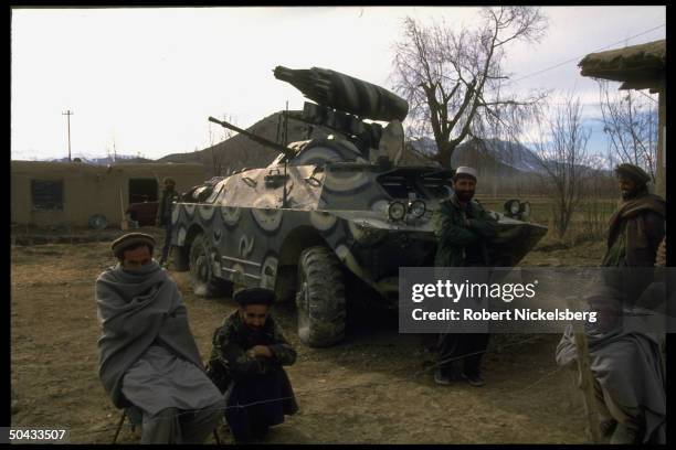 Fighters loyal to renegade PM Hekmatyar & ally Dostam at PM's base, w. Armored vehicle; Charasiab.