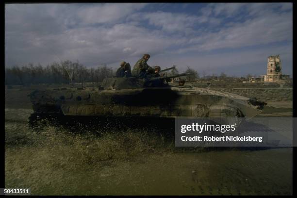 Soldiers loyal to Rabbani govt. Fighting renegade PM Hekmatyar & ally Dostam-led opposition, manning APC, on frontline.