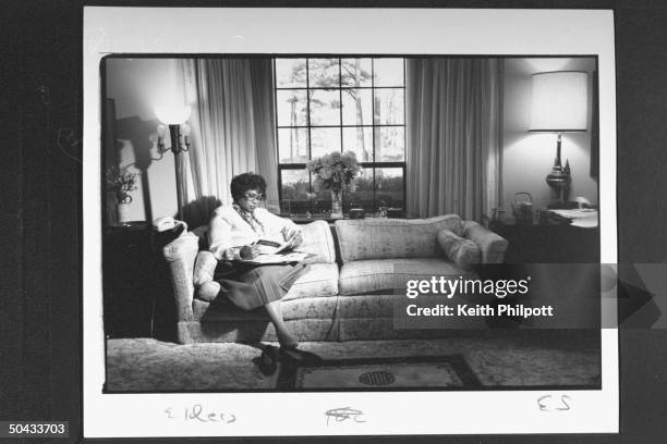 Surgeon Gen. Nominee Dr. Joycelyn Elders, the dir. Of the AR Dept. Of Public Health, going over documents as she sits on sofa at home.