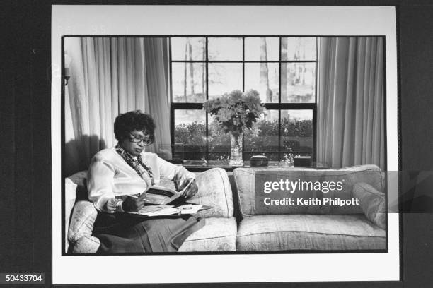 Surgeon Gen. Nominee Dr. Joycelyn Elders, the dir. Of the AR Dept. Of Public Health, going over documents as she sits on sofa at home.