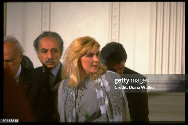 Dimitra Liani listening during her husband PM Andreas Papandreou's joint news conf. W. Pres. Clinton in WH E. Rm.