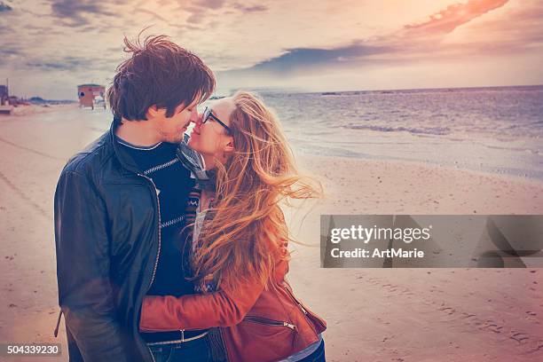 happy couple on the beach - air date stock pictures, royalty-free photos & images