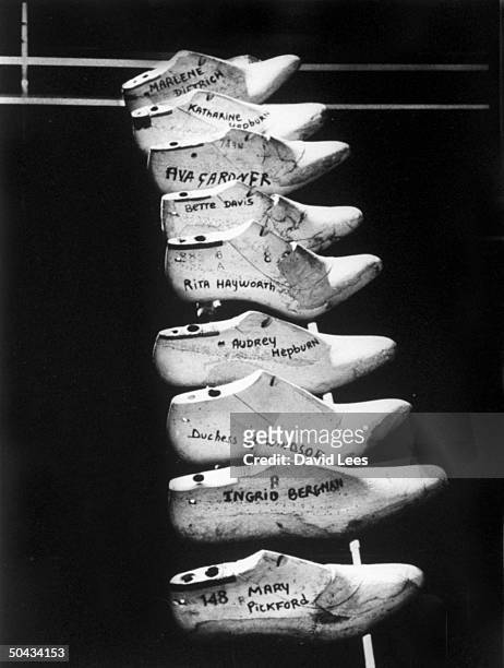 Wooden shoe forms of famous women at shoemaker Ferragamo--Mary Pickford, Ava Gardner, Marlene Dietrich, Duchess of Windsor, Katharine Hepburn, Rita...