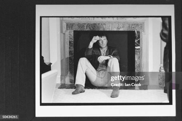 Actor David Trefall, who portrays Prince Charles in the TV drama based on author Andrew Morton's bk. DIANA, sitting in the non-functioning fireplace...