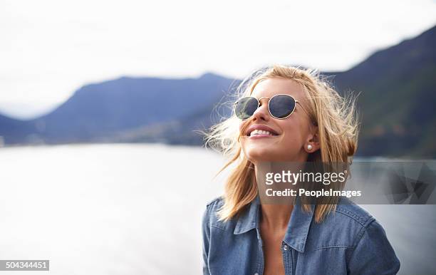 feeling free in nature - woman sunglasses stock pictures, royalty-free photos & images