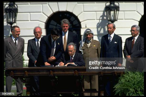 S Abbas, State Secy. Christopher, PLO chmn. Arafat, Israeli For. Min. Peres, Pres. Clinton, PM Rabin & Russia's Kozyrev at Israel/PLO peace accord...
