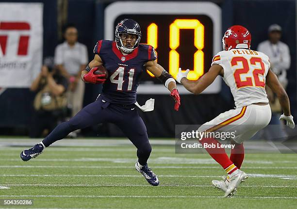 Jonathan Grimes of the Houston Texans looks top make a move on Marcus Peters of the Kansas City Chiefs during the AFC Wild Card game at NRG Stadium...