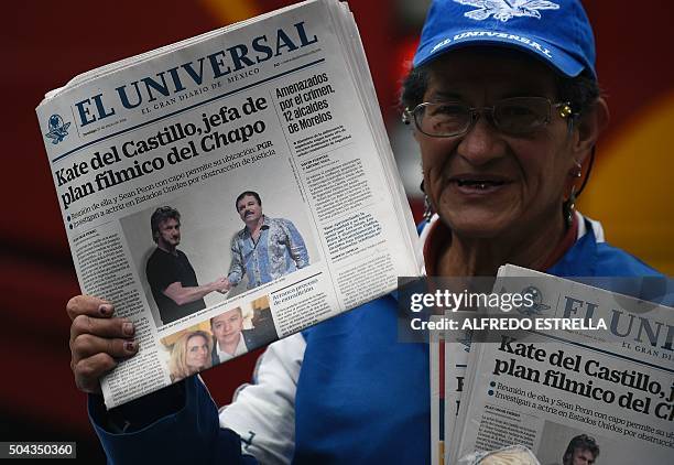 Vendor sells newspapers showing a picture of drug lord Joaquin Guzman, aka "El Chapo" , shaking hands with US actor Sean Penn, in Mexico City on...