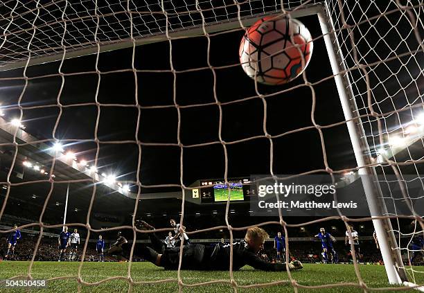 Goalkeeper Kasper Schmeichel of Leicester City dives in vain as Harry Kane of Spurs scores a late penalty to level the scores at 2-2 during The...