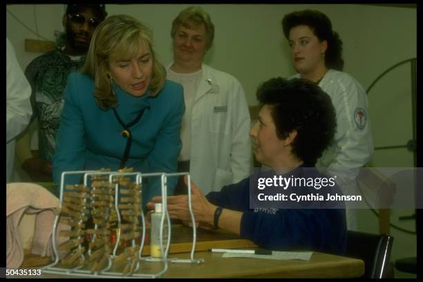 1st Lady Hillary Rodham Clinton w. Patient in physical therapy unit of St. Agnes Medical Ctr., re her heading Pres's health care reform task force.