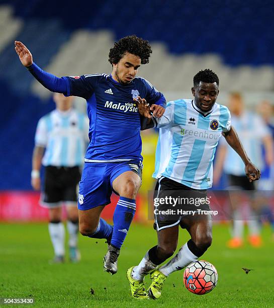 Larnell Cole of Shrewsbury Town is tackled by Fabio of Cardiff City during The Emirates FA Cup Third Round match between Cardiff City and Shrewsbury...