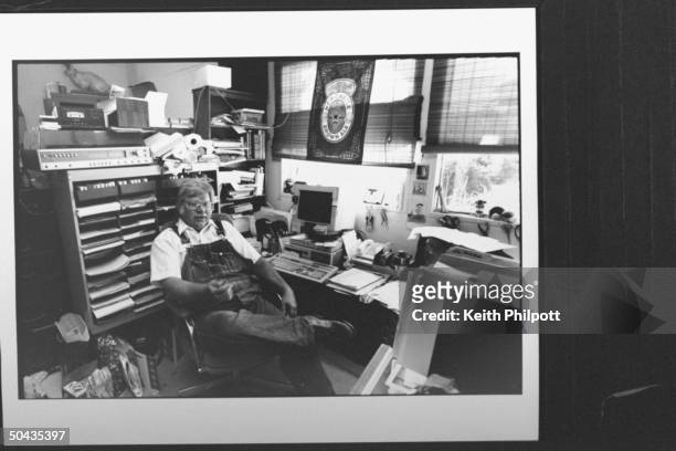 Roger Welsch, author & TV correspondent for CBS News Sunday Morning, sitting in his cluttered office in a shed on his farm.