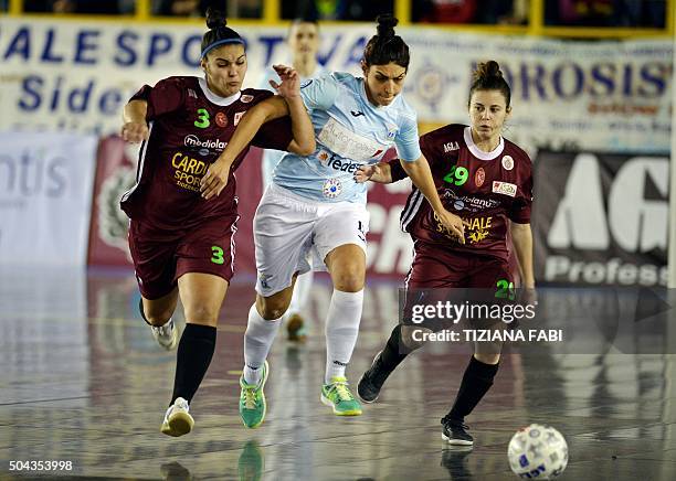 Lazio's Pamela Presto vies with Sporting Locri's Maria Soto and Noemi Viscoso during the women's futsal match between Sporting Locri and Lazio on...
