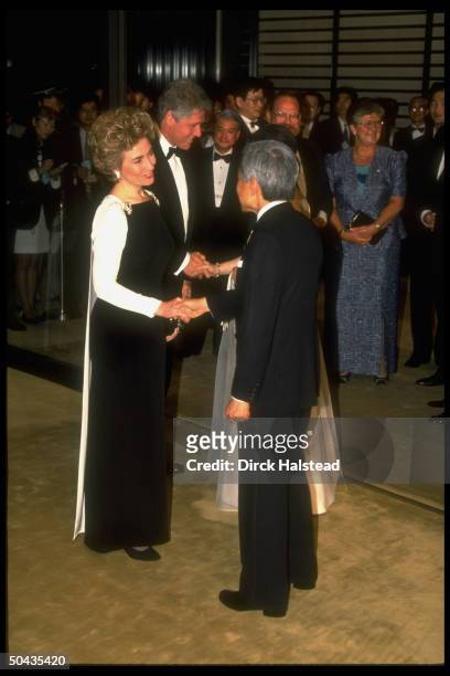 Pres. Bill & Hillary Rodham Clinton shaking hands w. Emperor Akihito & Empress Michiko during G7 summit dinner at the Imperial Palace.