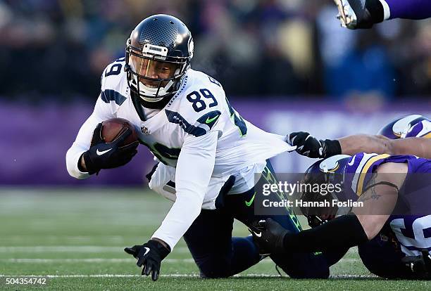 Doug Baldwin of the Seattle Seahawks is tackled in the second quarter against the Minnesota Vikings during the NFC Wild Card Playoff game at TCFBank...