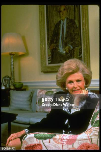 Democratic Party fundraiser, French Amb-designate Pamela Harriman at home, sitting in front of wall portrait of her late husband Averell Harriman.