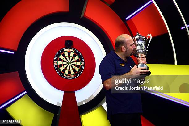 Scott Waites of England celebrates with the trophy after winning the Men's final match against Jeff Smith of Canada during Day Nine of the BDO...