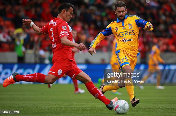 Aaron Galindo of Toluca struggles for the ball with Rafael Sobis of Tigres during the 1st round match between Toluca and Tigres UANL as part of the...