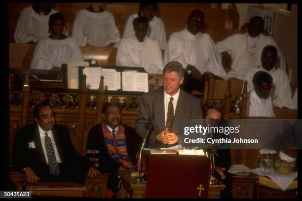 Pres. Bill Clinton speaking during Bethel AME Church Sun. Service, w. NY Gov. Mario Cuomo , Rep. Charlie Rangel , unident. Rev & choir members.