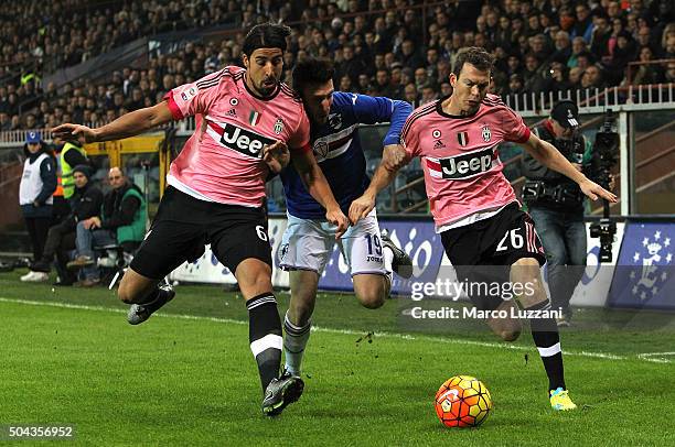 Vasco Regini of UC Sampdoria competes for the ball with Sami Khedira and Stephan Lichtsteiner of Juventus FC during the Serie A match between UC...