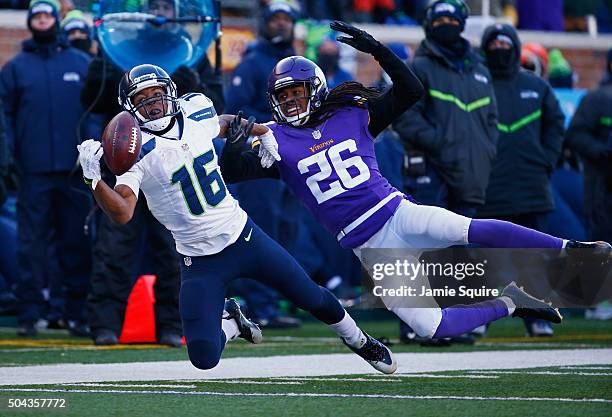 Tyler Lockett of the Seattle Seahawks is unable to catch a pass as he is defended by Trae Waynes of the Minnesota Vikings in the second half during...