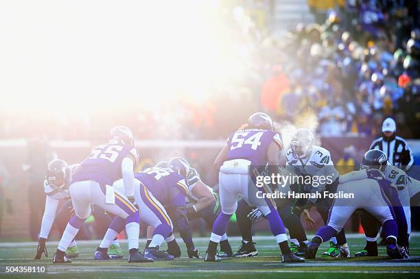 Russell Wilson of the Seattle Seahawks stands under center in the fourth quarter against the Minnesota Vikings during the NFC Wild Card Playoff game...