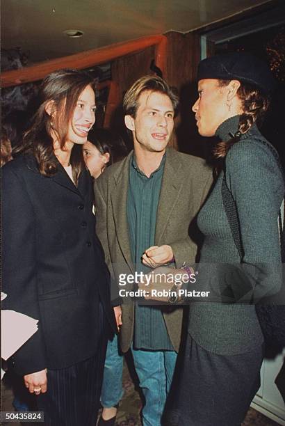 Actor Christian Slater w. Date, model Christy Turlington, & model Veronica Webb chatting at Halloween on the Green AIDS fundraiser, hosted by Magic...