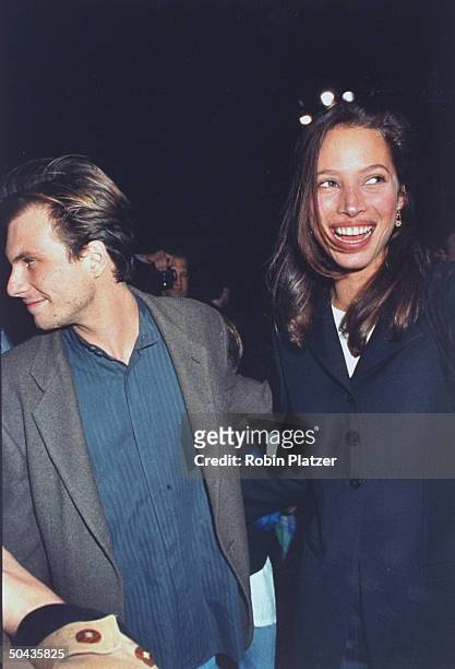 Actor Christian Slater w. Date, model Christy Turlington, at Halloween on the Green AIDS fundraiser, hosted by Magic Johnson, at Tavern on the Green.