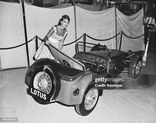 Canadian Sally Hall with a Lotus Seven kit car at the International Handicrafts and Do It Yourself Exhibition at Olympia, London, 2nd September 1959.