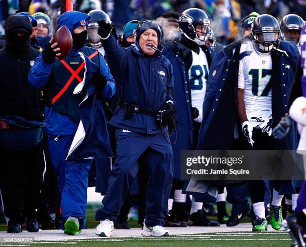 Head coach Pete Carroll of the Seattle Seahawks motions for a first down on the sidelines during the NFC wild card playoff game against the Minnesota...