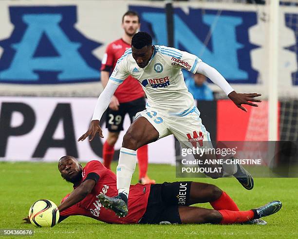 Guingamp forward Yannis Salibur vies with Marseille's Cameroonian midfielder Andre-Frank Zambo Anguissa on January 10, 2016 at the Velodrome stadium...